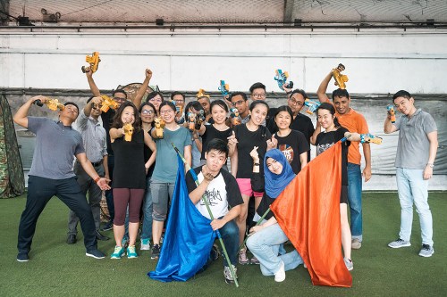 Cohesion event group celebrating during a team activity